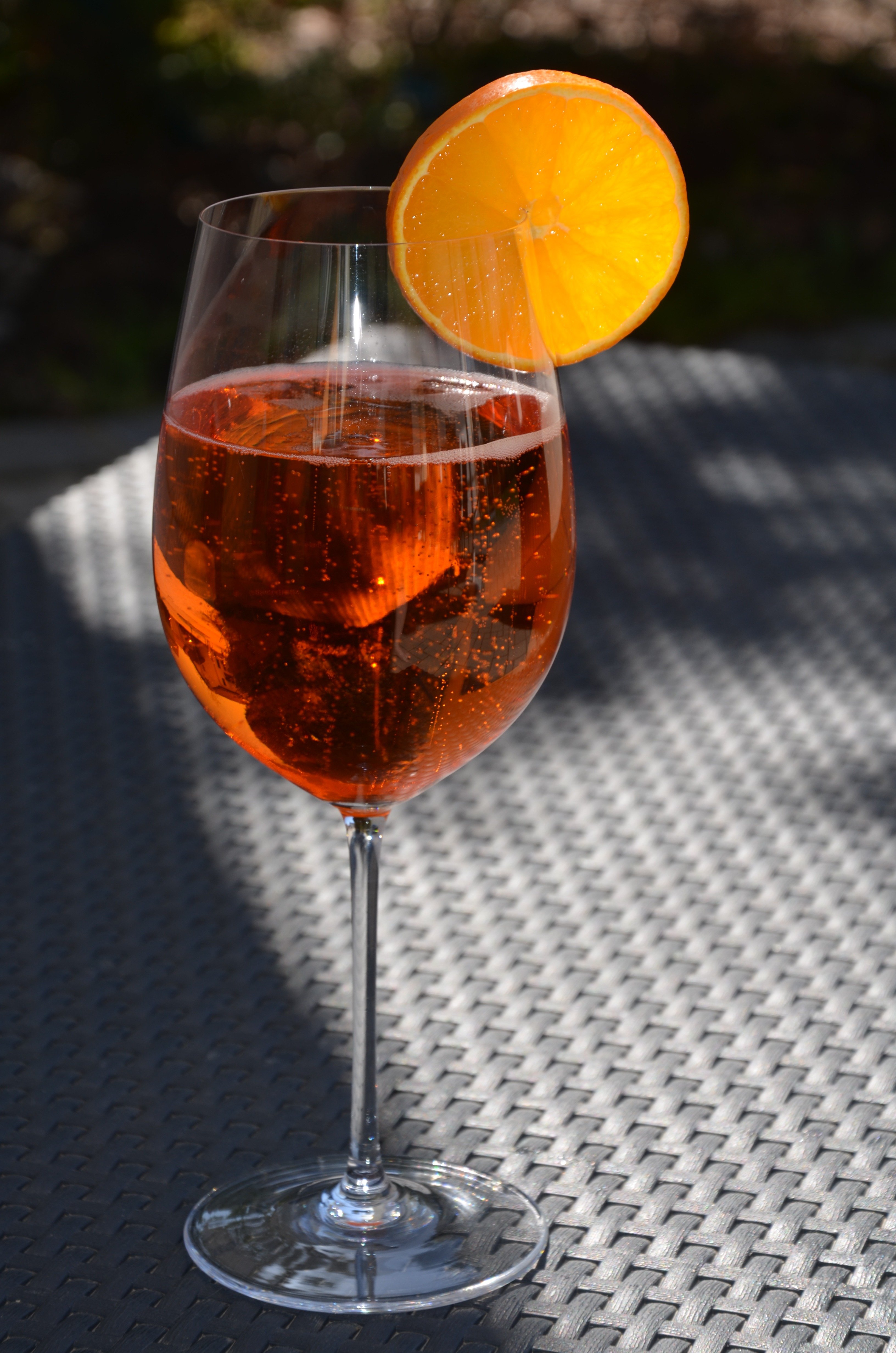 A glass of juice in a wine glass