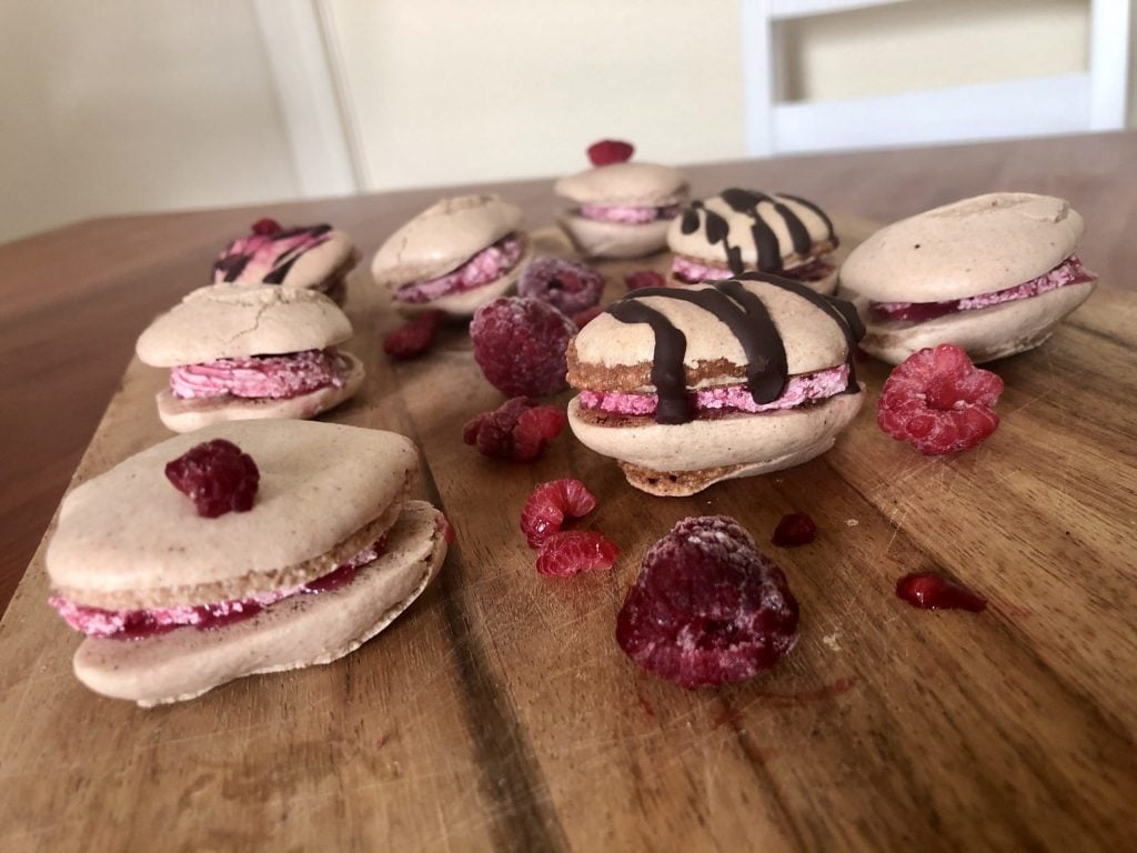 vegan macarons with fruit on a wooden surface