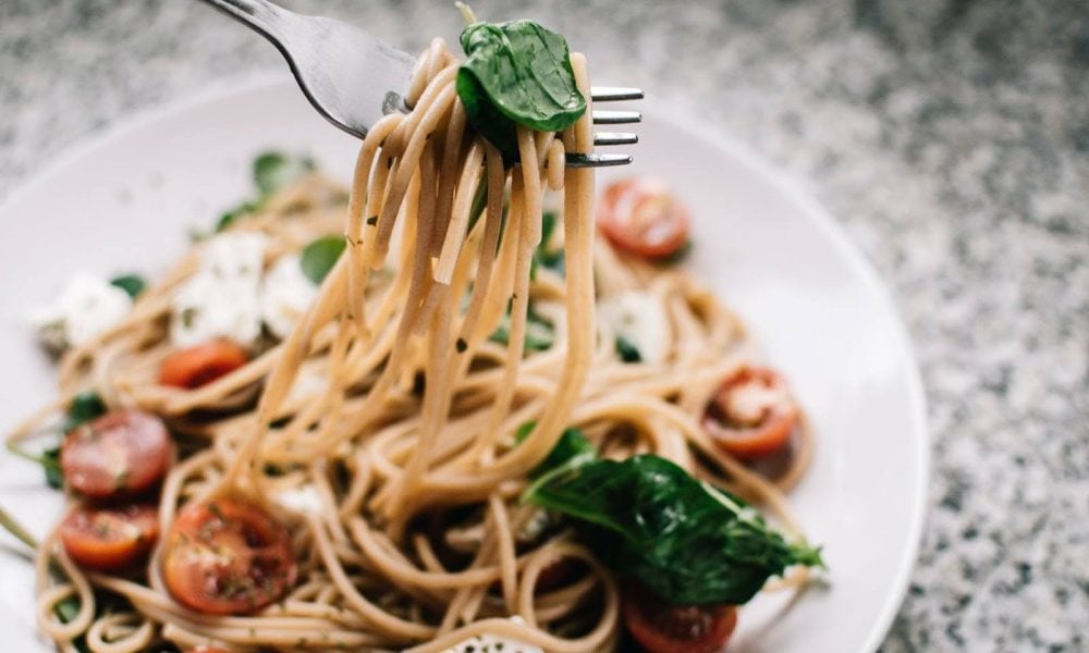 Fork lifting pasta out of bow